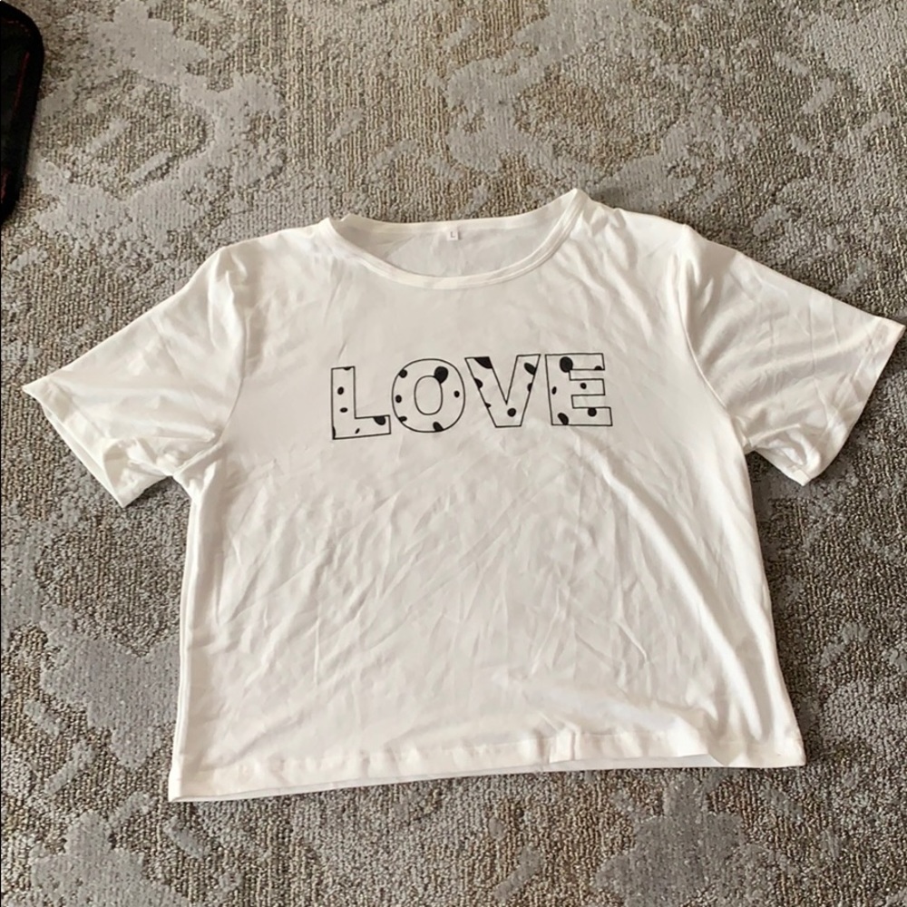 White, short sleeve, w/ “LOVE” decal in cow print!